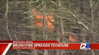 Flames from brush fire spread to North Smithfield home