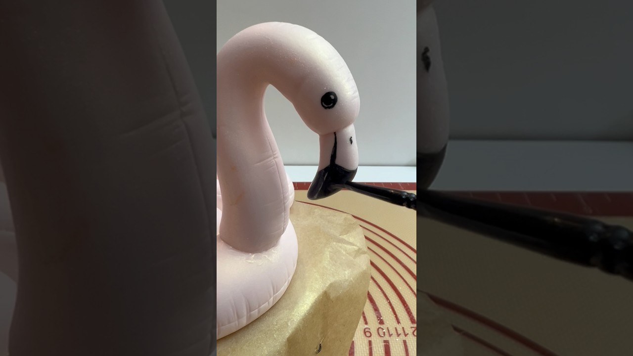 Making fondant flamingo float cake topper 