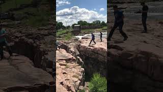 Man's Adventurous Jump Over a Trail as Son Cheers