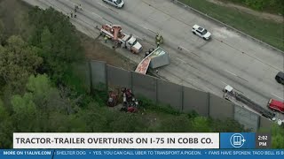 Tractor-trailer overturns, shuts down I-75 in Cobb