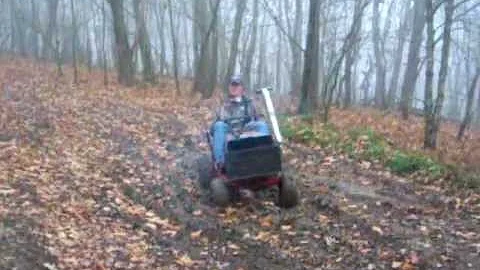 Ethan Hoke On mower go in mud on Peters mountain