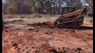 Digging trench with skid steer forks
