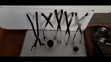 Tongs lifting and pouring graphite crucibles by Backyard Foundry South Africa.