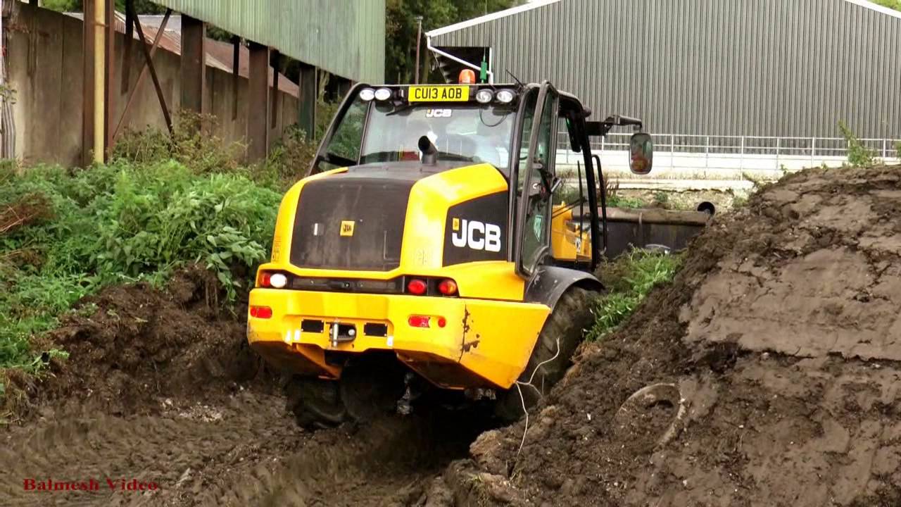 Muck-Spreading in between Showers.  Maize is OFF.
