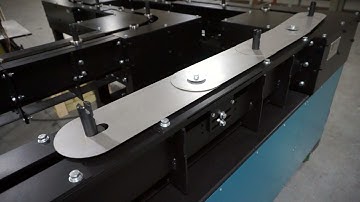 Mechanical Detent Example on a Chain-On-Edge Conveyor