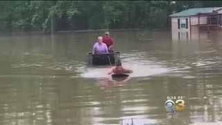 Man Rescues In-Laws From Flood Using Paddle Board
