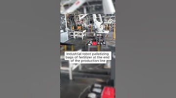 #Industrial #robot #palletizing bags of #fertilizer at the end of the production line.#automation