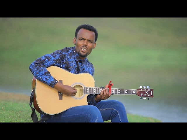 #ዋእ ሞኦላ በዘማሪ ዮሴፍ ሳሙኤል New Protestant Mezmur Official Video ተለቀቀ Jan-09-2019 class=