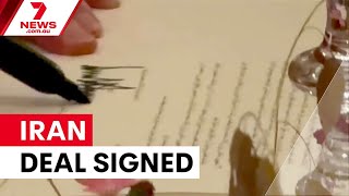 Trump signs Iran peace deal at Versailles | 7NEWS