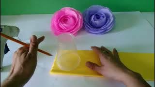 Crepe paper roses. Made with a glass.