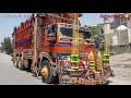 Full decorations truck on road  with very beautifull pakistani truck art
