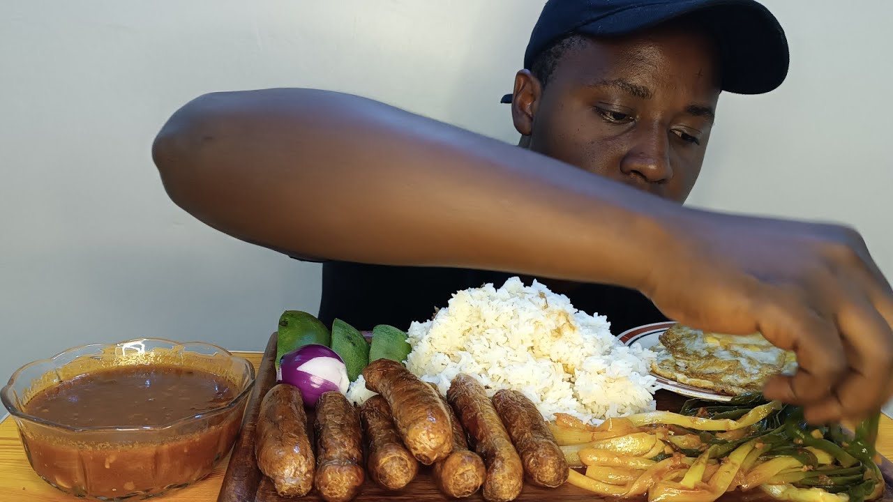 KENYAN MUKBANG/ASMR; EATING SAUSAGES, EGGS, RICE AND SALAD. YouTube