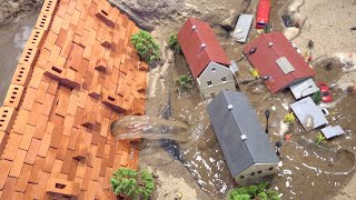 Emergency Water Discharge And Mini Brick Model Dam Failure Near Town - Diorama Dam Breach