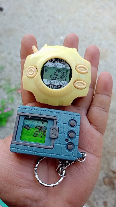 Digimon Digivice D2 1999 glow in the dark vs Vpet 1997 Garurumon vs darkmon