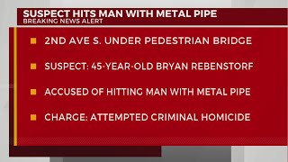 Man charged with hitting victim with metal pipe downtown