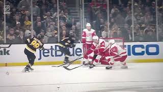 Moritz Seider hit in face with puck during Red Wings vs. Bruins matchup.