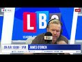 James O'Brien reacts as anti-migrant protestors storm homes