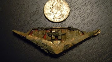 Metal detecting at local parks. Silver in the hole x 2! Need help to ID this find. Minelab E-trac