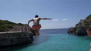 Two crazy guys cliff jumping at CALA EN BRUT in MENORCA