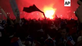 Fans celebrated in Santiago after Chile knocked Spain out of World Cup competition. Spain won the pr Fans celebrated in Santiago after Chile knocked Spain out of World Cup competition. Spain won the pr