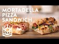 Mortadella pizza sandwich with fresh cheese and pistachio