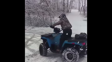 Doing donuts on a sheet of ice on the sportsman 450