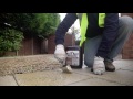 Applying easy black spot remover  for patios paths and drives