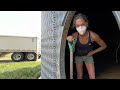 Hand Shoveling Out A Grain Bin