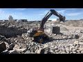 Volvo ec530 excavator in quarry feeding jonsson 1208 jaw crusher komatsu wa500