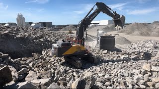 volvo ec530 excavator in quarry feeding jonsson 1208 jaw crusher. komatsu wa500