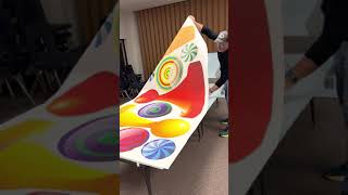 Adhering the sticker to the foam board