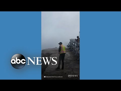 Yellowstone park ranger attempts to save visitor's hat lost in geyser - Yellowstone park ranger attempts to save visitor's hat lost in geyser