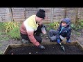 🌱KIDS GARDENING | PLANTING THIS YEARS VEGGIES IN THE POURING RAIN!!!!☔️