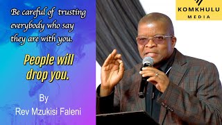 Be careful of easily trusting people who claim to be with you. They will drop you. - Rev Faleni.