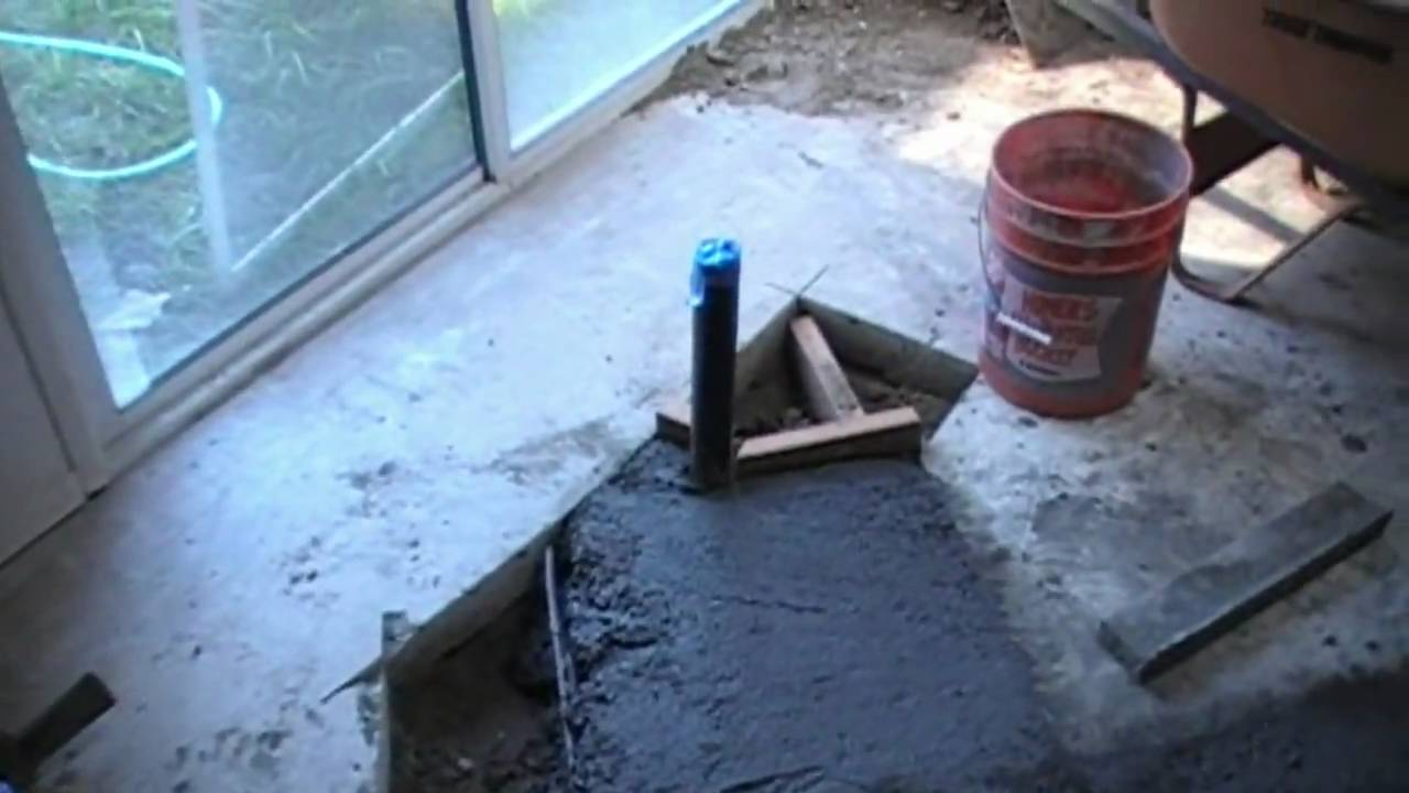 How do you install plumbing in a concrete slab?