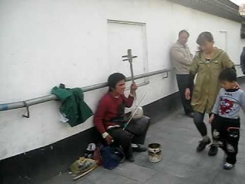 A Wonderful Blind Man Playing Traditional Instrume...