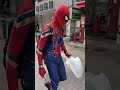 Spider-Man picking up trash