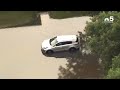 Suburban streets submerged in water after torrential rainfall