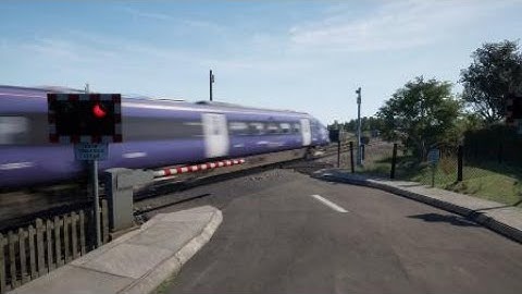 Class 395 passing a level crossing in TSW