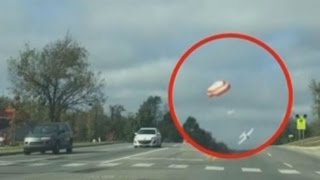 Emergency landing filmed: Small plane crashes onto highway by parachute