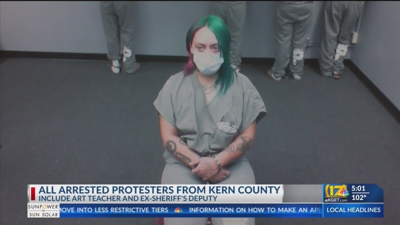 Woman pleads not guilty to assaulting officer during protest - YouTube