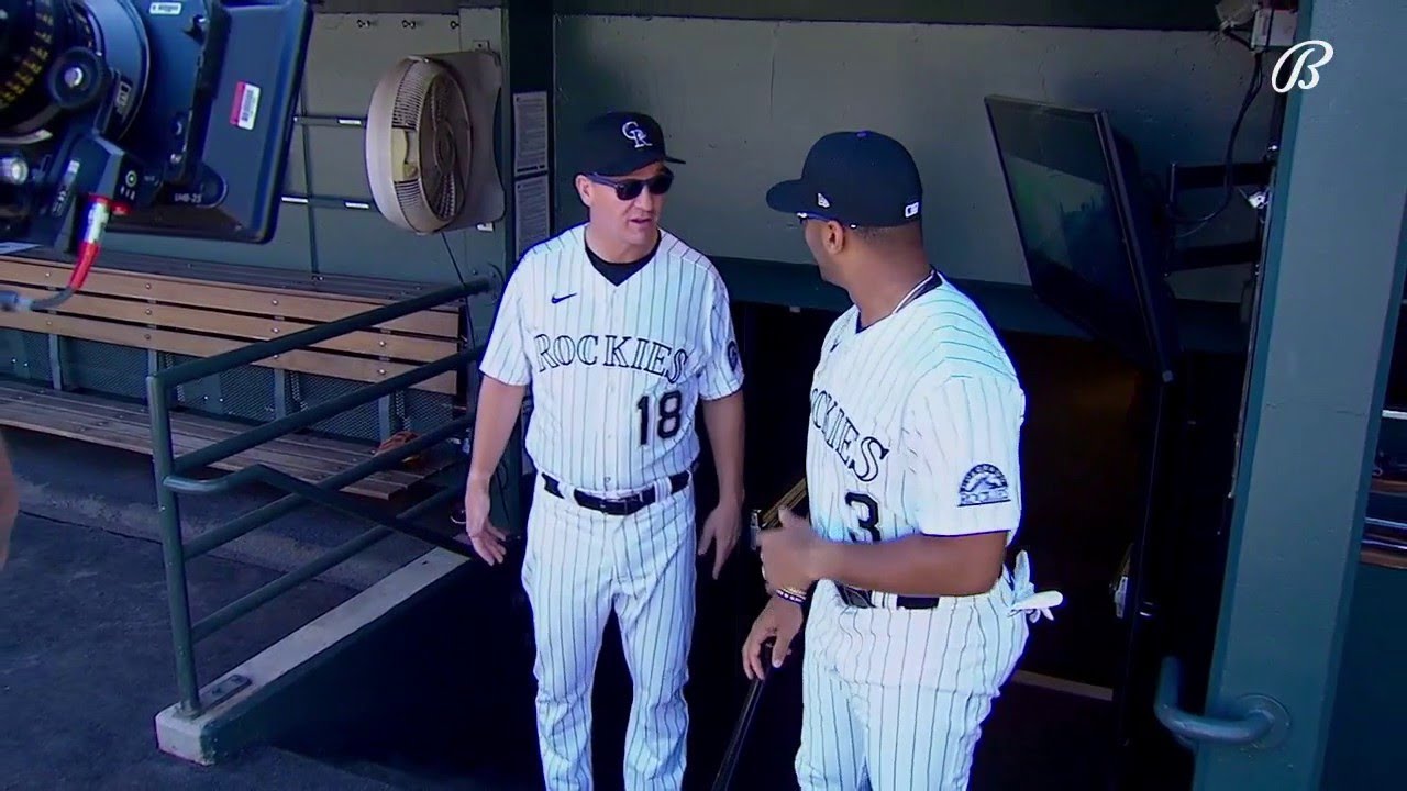 Peyton Manning and Russell Wilson take batting practice at Coors Field 