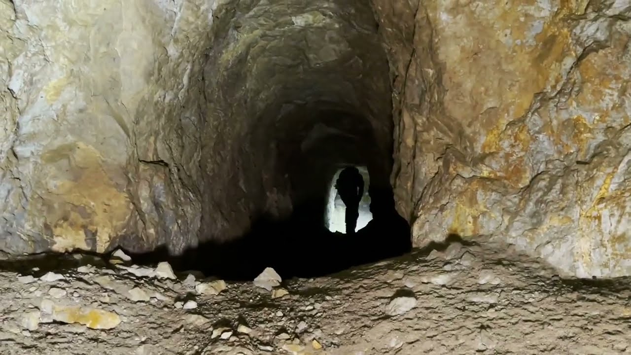 Digging into an old abandoned collapsed silver mine in New Mexico . 