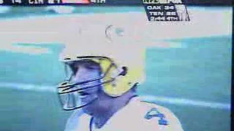 Greg Gall takes football from Brett Favre