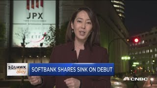 Softbank shares sink on debut