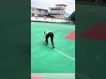 Laying the Lines: Two Workers Mark a New Basketball Court