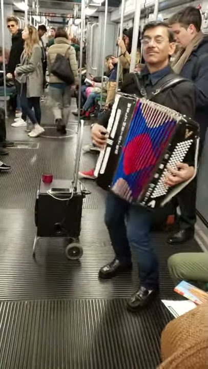 Russian accordion tune in a Milan metro