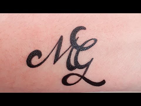 'M' and 'G' name couple tattoo #shorts #trending #combinelettertattoo #initialtattoo #calligrahy