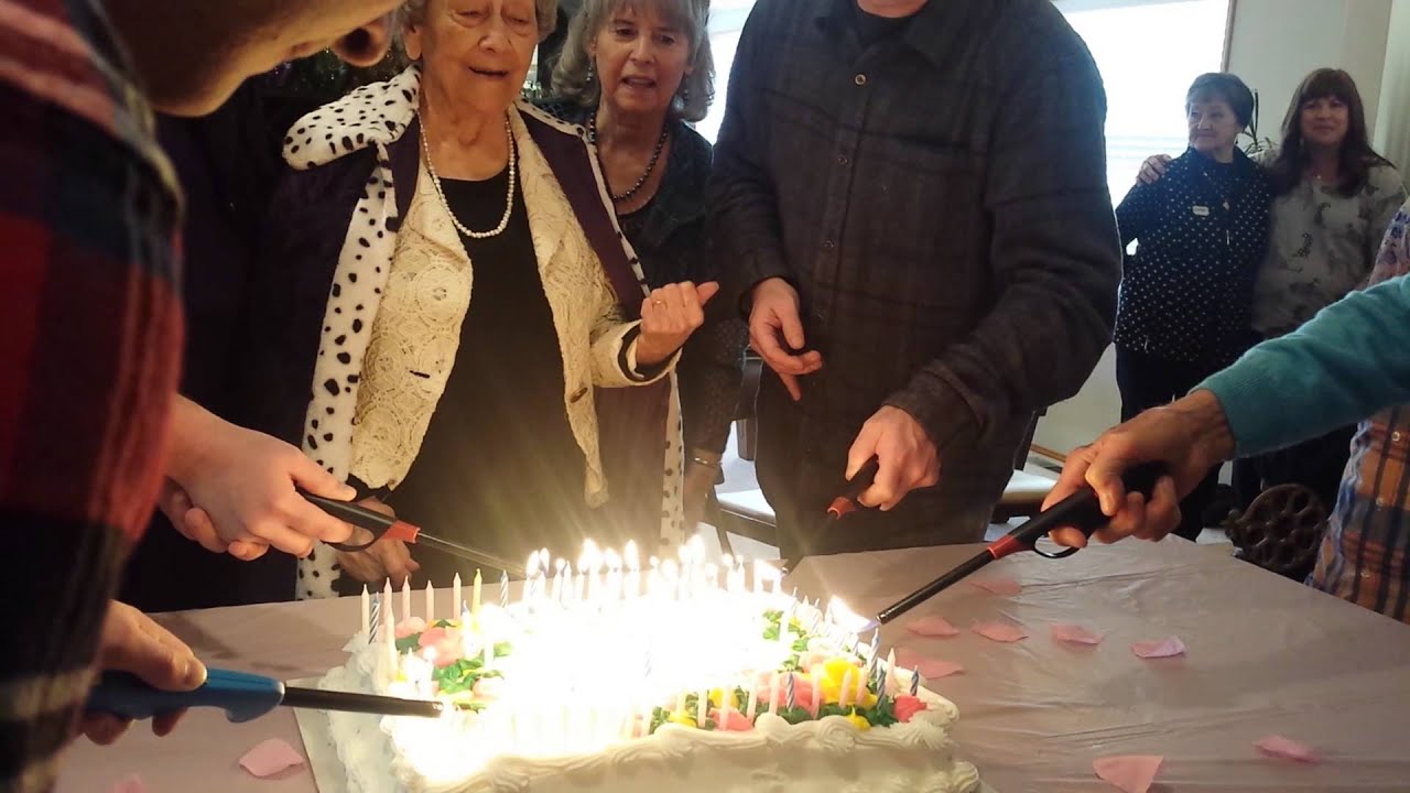 100 yr old Grandma blows out her own birthday cake