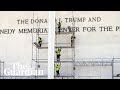 Workers set up scaffolding outside Kennedy Center